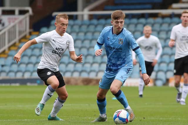 Louis Reed (left) in action for Posh. Photo: Joe Dent/theposh.com.