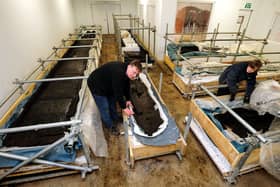 Bronze Age longboats discovered at Must Farm being stored at Flag Fen. Photo: Rui Vieira/PA Wire ENGEMN00120130306082333