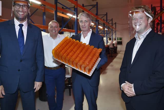 Paul Bristow and  Ranjl Jayawardena, Minister for international trade visiting Photocentric at  Peterborough trying out the Covid masks made by the company. Also pictured  Paul Holt (MD) and Paul McGurk (in charge of manufacturing) EMN-200917-145346009
