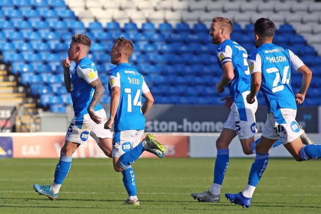 Sam Szmodics runs away to celebrate after scoring Posh's winner against Fleetwood (Picture: Joe Dent)