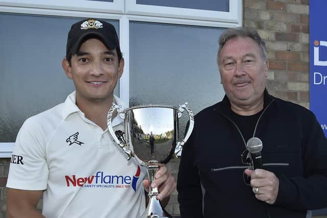 Peterborough Town captain David Clarke receives the Northants Premier Division Cup from David Hartley, chairman of the Northants League. Photo: David Lowndes.
