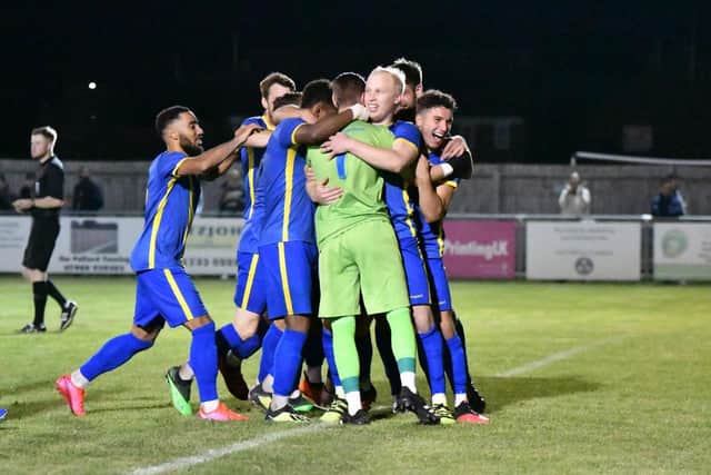 Peterborough Sports players celebrate their FA Cup penalty shootout win over Enfield. Photo: James Richardson.