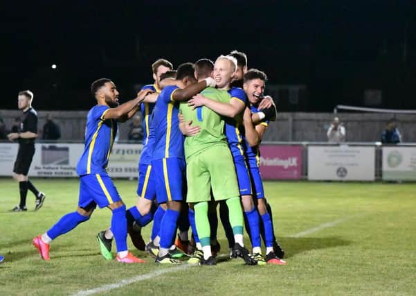 Peterborough Sports players celebrate their FA Cup penalty shootout win over Enfield. Photo: James Richardson.
