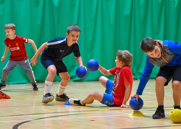 Children enjoy a game of dodgeball at Youth Dreams Project Summer Camp