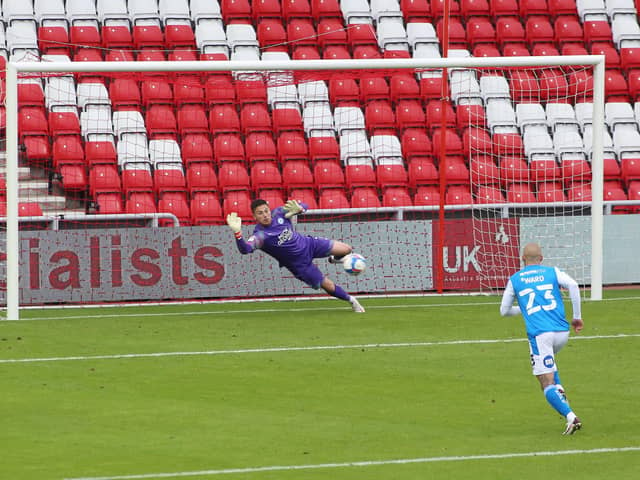 Christy Pym of Peterborough United dives in vein as Grant Leadbitter of Sunderland (not in picture) scores the only goal of the game. Photo: Joe Dent/theposh.com.