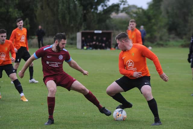 Action from Stamford Bels' (orange) 1-0 win against Thorpe Wood Rangers at Woodlands in Peterborough Division One. Photo: David Lowndes.