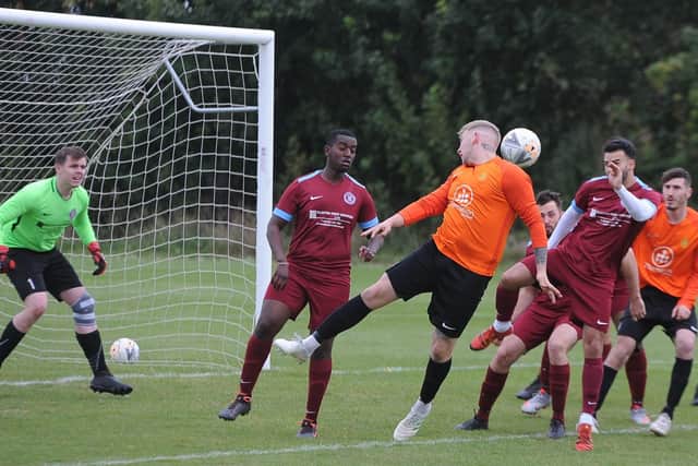 Action from the Peterborough Legue Division One game between Thorpe Wood Rangers and Stamford Bels (orange). Bels won 1-0. Photo: David Lowndes.