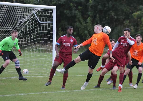 Action from the Peterborough Legue Division One game between Thorpe Wood Rangers and Stamford Bels (orange). Bels won 1-0. Photo: David Lowndes.