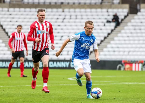 Louis Reed in action with Aiden O'Brien of Sunderland. Photo: Joe Dent/theposh.com.