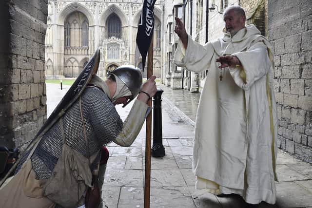 Lewis Kirkbride, dressed as one of King Harold's warriors on his 1066 Battle Walk for Man Health, passing through Peterborough. He was met by local Anglo-Saxon re-inactors including Sawtry abbot Martin Owen.