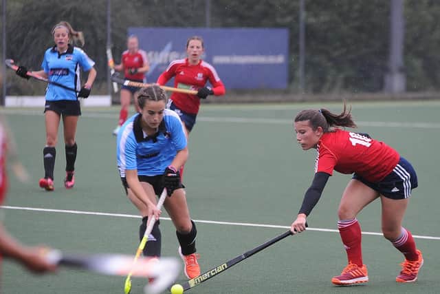 Action from City of Peterborough Ladies (red) East Premier Division win over Ipswich & East Suffolk. Photo: David Lowndes.