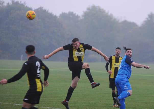 Action From Crowland Town's 3-1 win at ICA Sports (blue) in the Peterborough Premier Division. Photo: David Lowndes.