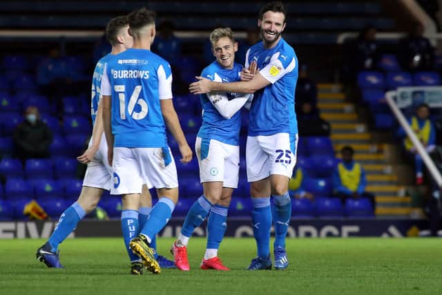 Sammie Szmodics (centre) is congratulated for his Posh goal against Fulham Under 21s. Photo: Joe Dent/theposh.com.