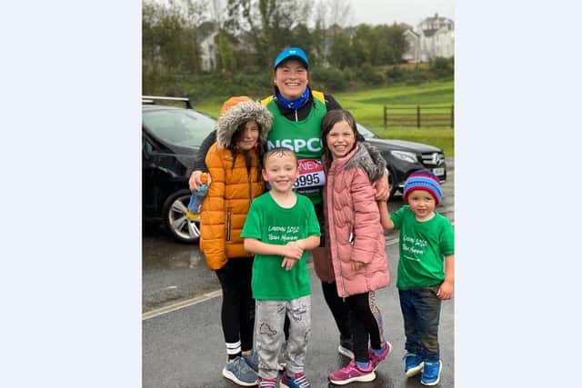 Vicky and her family braving the the elements for her marathon run