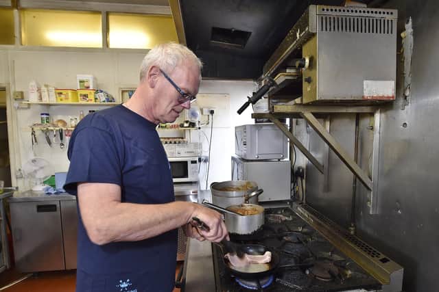 Colin preparing breakfast at his hotel in Whittlesey