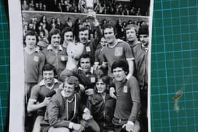 The 1973-74 Posh Fourth Division title-winning side. Captain John Cozens is holding the trophy, Tommy Robson is just below him.