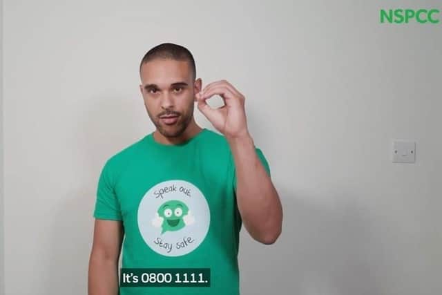NSPCC worker demonstrates how to contact Childline