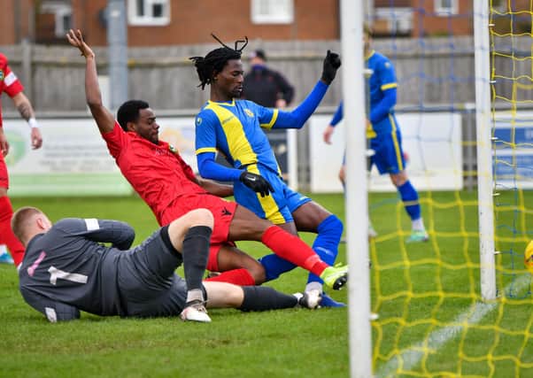 Maniche Sani bundles Peterborough Sports in front against Barwell. Photo: James Richardson.