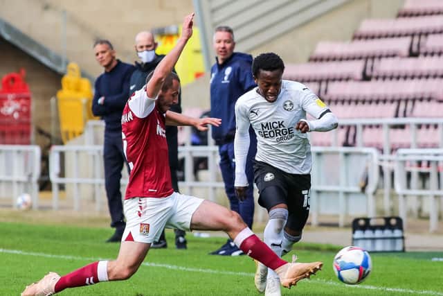 Posh man of the match Siriki Dembele takes on Michael Harriman of Northampton Town. Photo: Joe Dent/theposh.com.