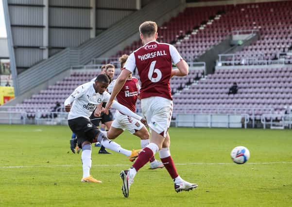 Posh midfielder Reece Brown scores his goal against Northampton Town. Photo: Joe Dent/theposh.com.