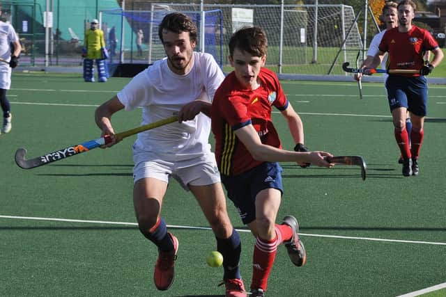 Josh Heyworth (red) in action for City of Peterborough against Cambridge City. Photo: David Lowndes.