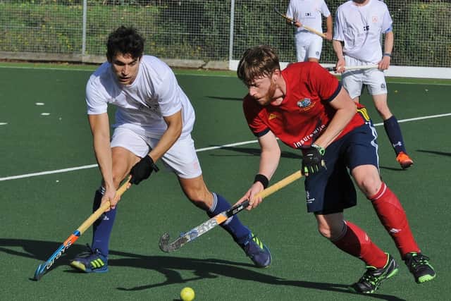 Goalscorer Chris Clarkson (red) in action for City of Peterborough against Cambridge City. Photo: David Lowndes.
