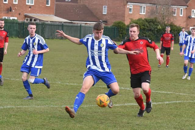 Stilton United's Ash Jackson (red) in his Netherton United days.
