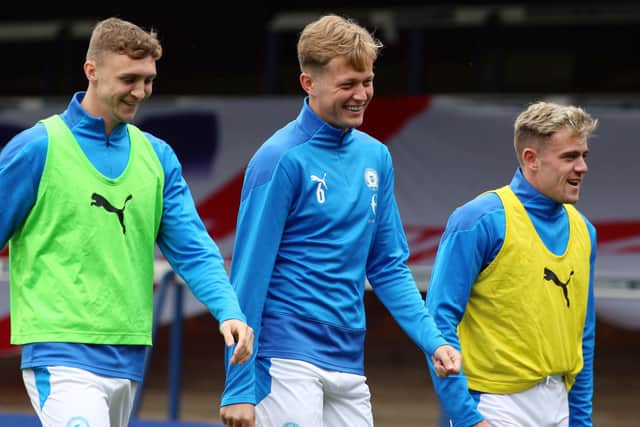 Jack Taylor (left) should return to the Posh starting line-up alongside Frankie Kent (centre) and Sammi Szmodics. Photo: Joe Dent/theposh.com.