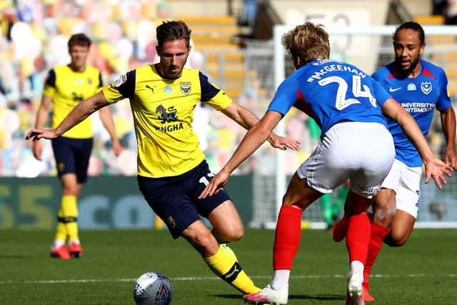 James Henry (yellow) in action for Oxford.