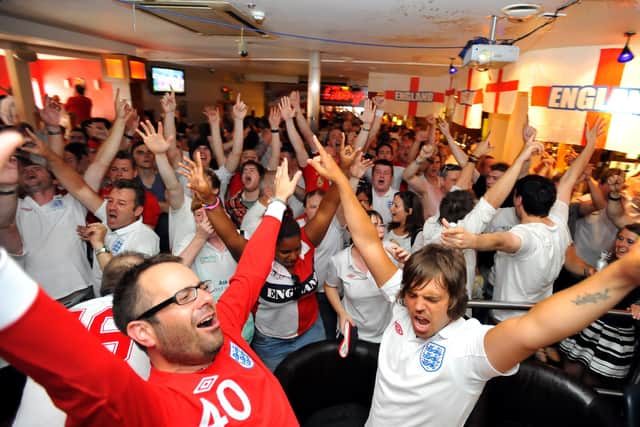 England fans watch the Slovenia world cup group game at the Solstice. 
Warren Elsom and Paul Naylor celebrate England's victory