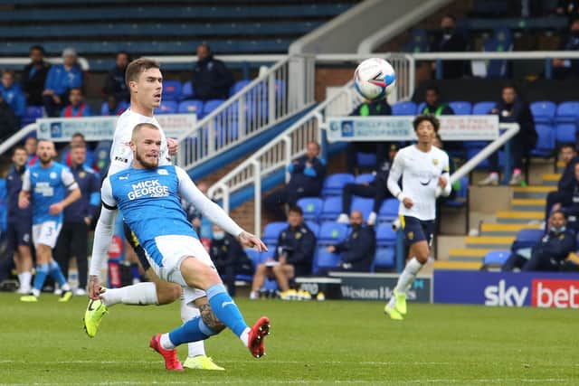 Joe Ward of Peterborough United scores the opening goal of the game against Oxford United. Photo: Joe Dent/theposh.com.