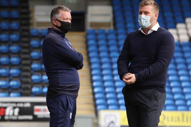 Peterborough United Manager Darren Ferguson (left) talks with Oxford United manager Karl Robinson before the match. Photo: Joe Dent/theposh.com.