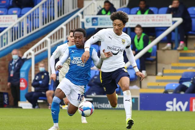Siriki Dembele of Peterborough United in action with Sean Clare of Oxford United. Photo: Joe Dent/theposh.com.