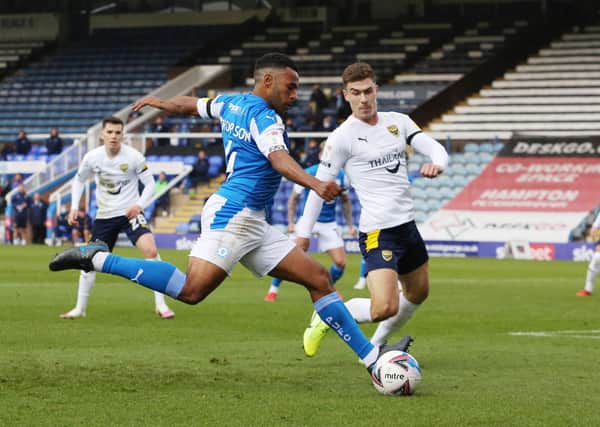 Nathan Thompson of Peterborough United in action against on Josh Ruffels of Oxford United. Photo: Joe Dent/theposh.com.