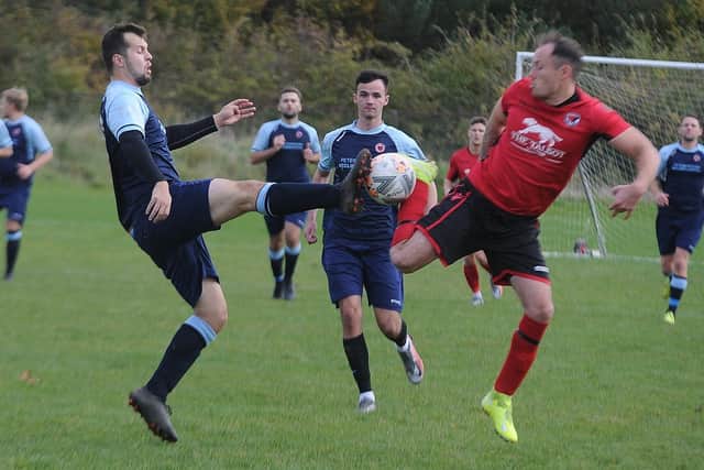 Action from Netherton United (blue) v Stilton United. Photo: David Lowndes.