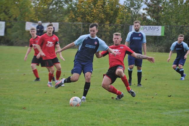 Action from Netherton United (blue) v Stilton United. Photo: David Lowndes.
