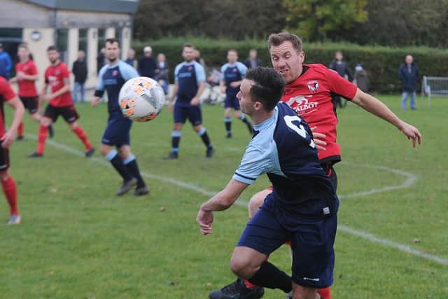 Action from Stilton v Netherton (blue) in the Peterborough Premier Division last weekend. Photo: David Lowndes.