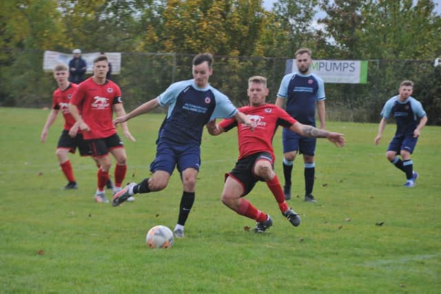 Action from Stilton v Netherton (blue) in the Peterborough Premier Division last weekend. Photo: David Lowndes.