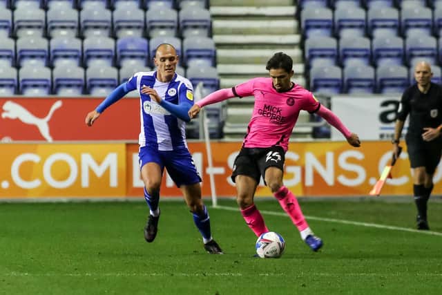 Niall Mason in action for Posh at Wigan. Photo: Joe Dent/theposh.com.