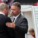 Doncaster Rovers manager Darren Ferguson shakes hands with Peterborough United manager Grant McCann before a League One game in September, 2017.