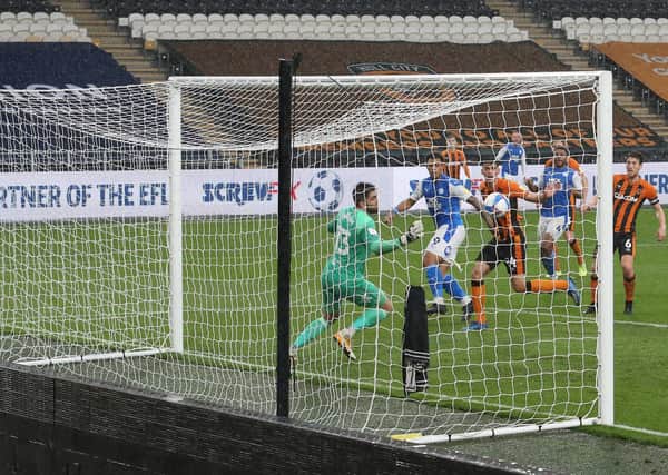 Jonson Clarke-Harris of Peterborough United watches as the ball goes into the back of the net for the equalising goal at Hull City. Photo: Joe Dent/theposh.com.
