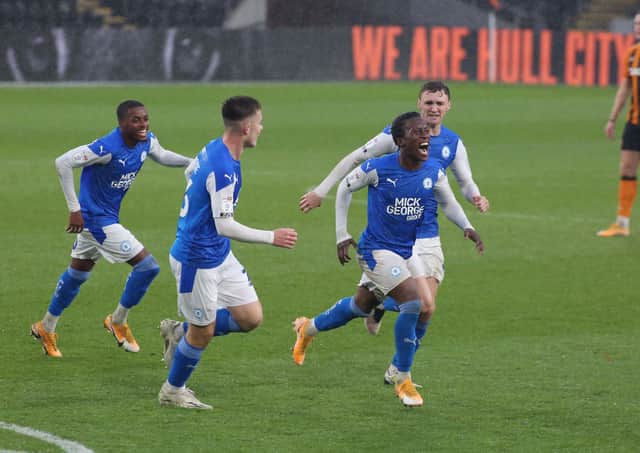 Siriki Dembele of Peterborough United celebrates scoring his goal against Hull City. Photo: Joe Dent/theposh.com/