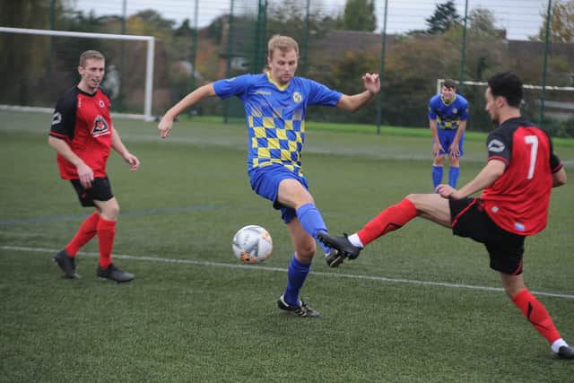 Action from Peterborough Sports North End's win at Netherton. Sports are wearing blue. Photo: David Lowndes.
