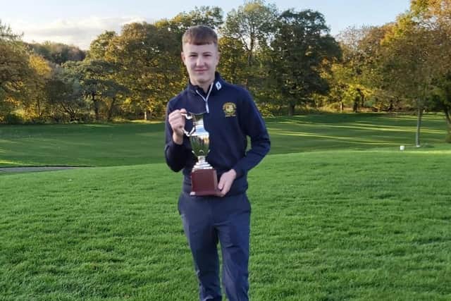 Milton's Charlie Pearce with the English Junior Inter-club trophy.