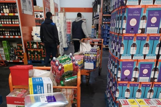 Volunteers from the Brotherhood Foundation shop for items to go into food parcels