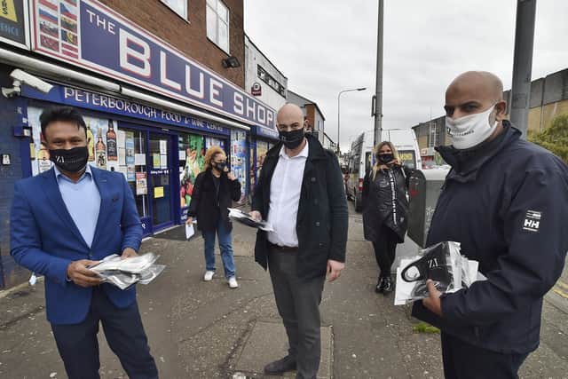 Zillur Hussain with Chavdar Zhelev and Ishy Hussain handing out face coverings in Peterborough