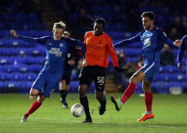 Nile Ranger (orange) in action for Southend against Posh in 2017.
