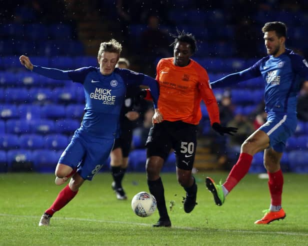 Nile Ranger (orange) in action for Southend against Posh in 2017.
