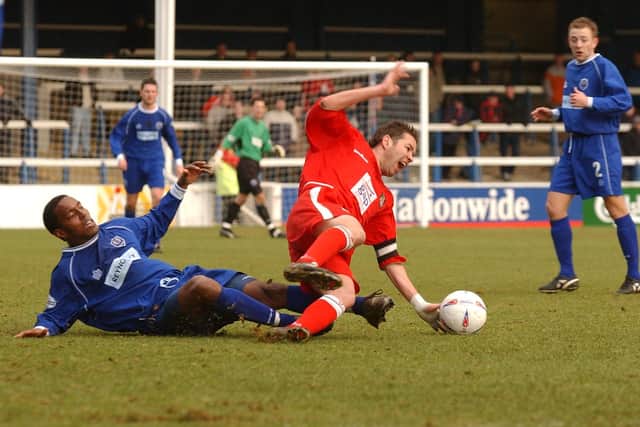 Posh defender Sagi Burton crunches Darren Ferguson when the current Posh boss was playing for Wrexham.