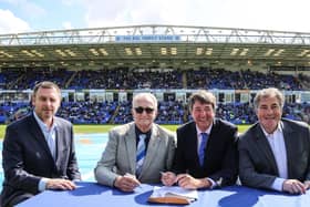Peterborough United Co-owners Stewart Thompson, Darragh MacAnthony and Jason Neale along with Councillor John Holdich, leader of Peterborough City Council.